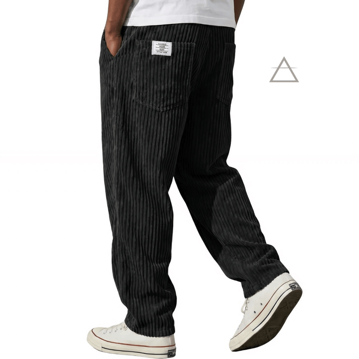 Pantalon Jules pour homme en velours côtelé noir, à coupe ample et taille élastiquée avec cordon de serrage.⠋